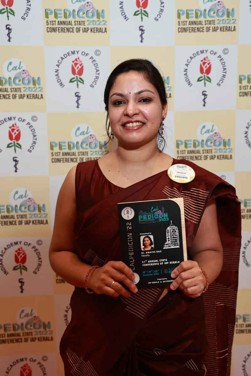 Dr. Swathi Rao holding a faculty memento at CalPedicon 2022