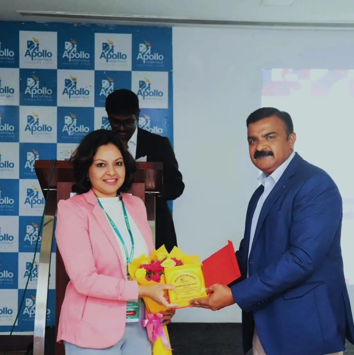Dr. Swathi Rao being presented a memento and flowers after a session