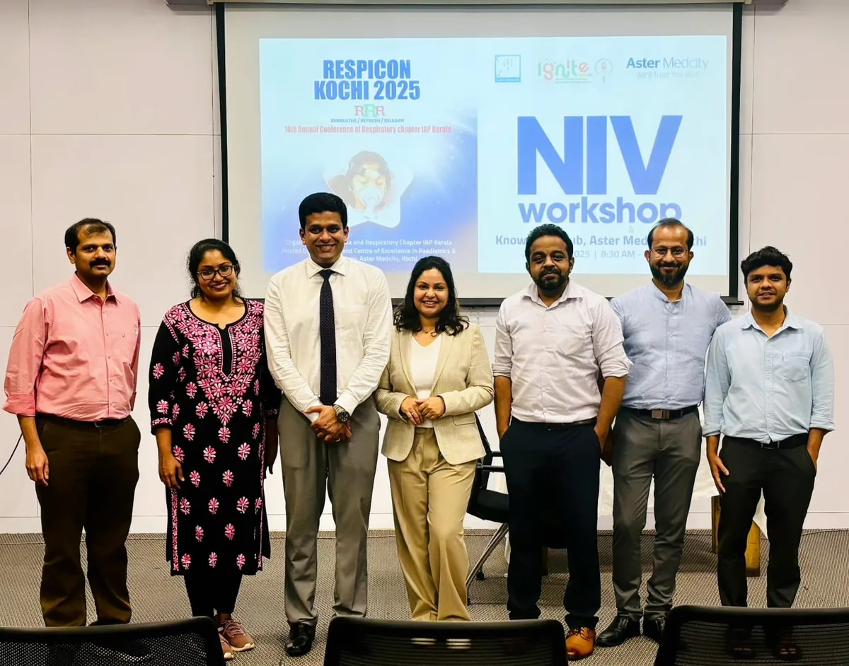 NIV workshop faculty in front of the Respicon Kochi 2025 screen