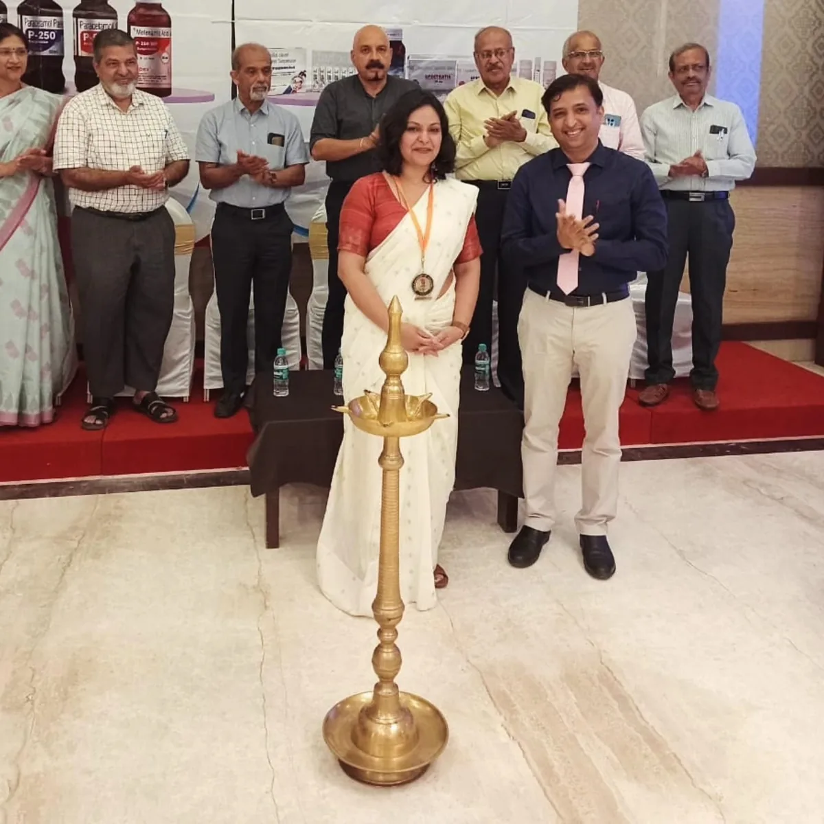 Dr. Swathi Rao lighting the ceremonial lamp at a pediatric CME